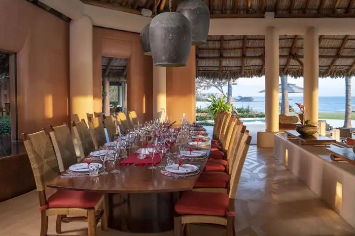 The dining table looking out over the pool to the ocean
