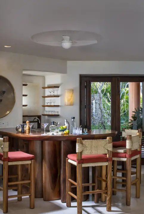 The indoor bar with its stools and wooden counter
