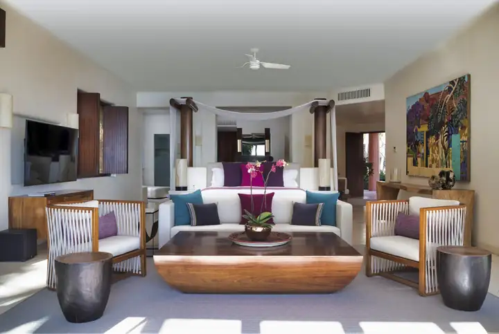 Master Suite 1: the sitting area with its carved wood table and artwork