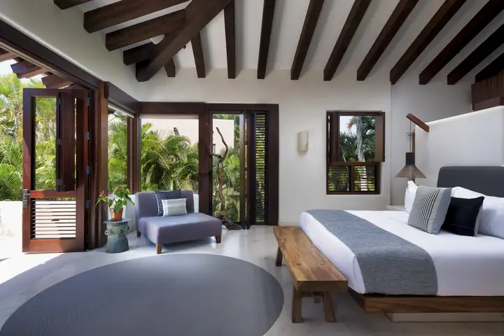 Guest Suite 6: the king bed and the garden-view doors