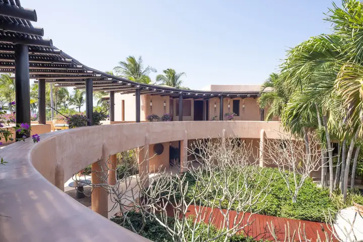 The curving upper walkway and pergolas looking towards the sea